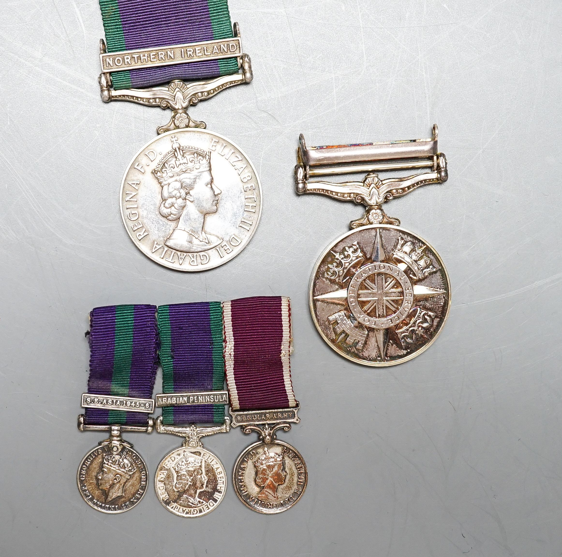 Various QEII medals to include GSM with Northern Ireland clasp to D8008248 SAC R. GILBERT RAF, Afghanistan OSM To 24795570 SGT A. J. PUGSLEY RAMC (R), together with George VI and QEII miniature GSM etc.